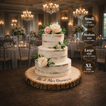 Load image into Gallery viewer, Personalised wood slice wedding cake stand with natural bark edge and custom engraved names for rustic wedding cake display.