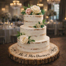 Load image into Gallery viewer, Personalized Wood Slice Cake Stand, Engraved Rustic Wedding Engagment Display stand, Personalised Engraved log Slice with Lillies
