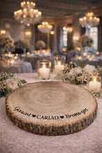 Load image into Gallery viewer, Personalised CARIAD Log Slice Cake Stand, Welsh Wedding Cake Stand, Rustic Wedding Cake Base, Engraved Names, Engagement Dessert Board
