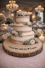 Load image into Gallery viewer, Personalised CARIAD Log Slice Cake Stand, Welsh Wedding Cake Stand, Rustic Wedding Cake Base, Engraved Names, Engagement Dessert Board
